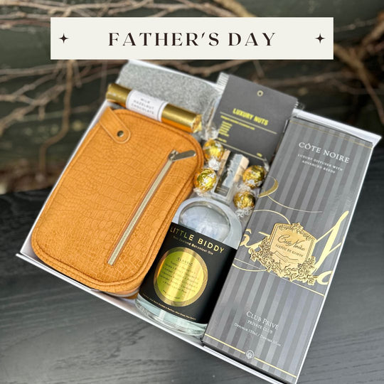 Father's Day Gifts to celebrate the impact of Dad this Father's Day. Image shows a gift box for him featuring chocolate, Cote Noire and more