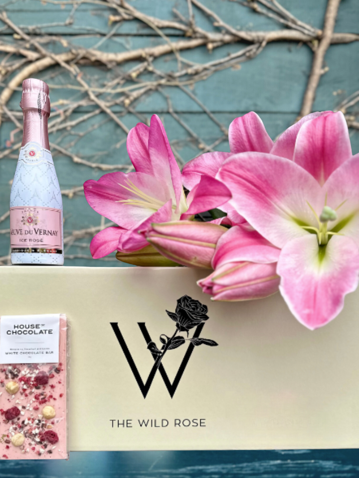 Pretty In Pink Gift Box | Get a Flower Gift Box delivered filled with pink Lillies, House Of Chocolate & Bubbles delivered NZ wide. Flower Delivery Auckland 7 days or NZ wide overnight.